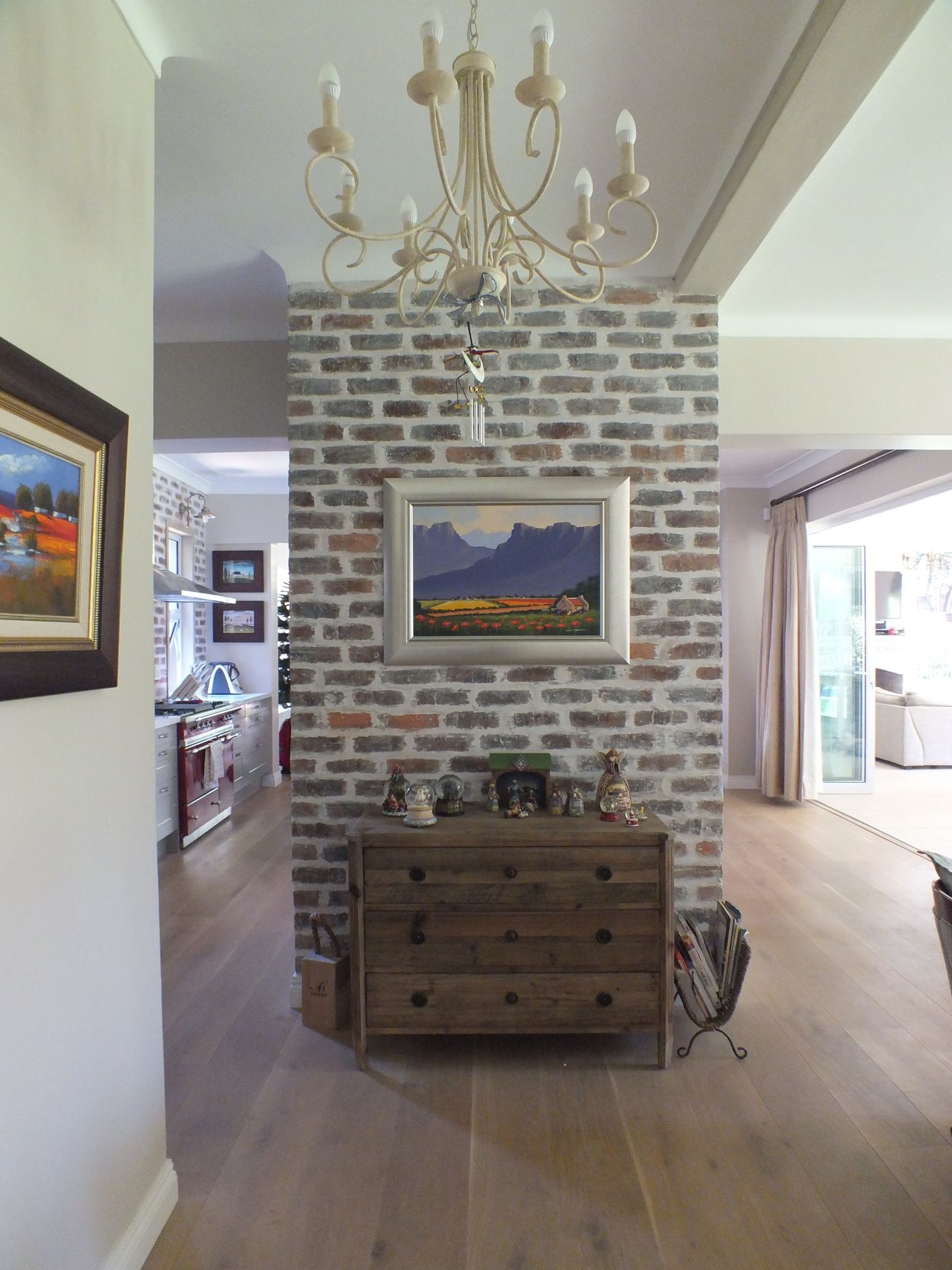 Brick pier between kitchen and living room — House in Atholl