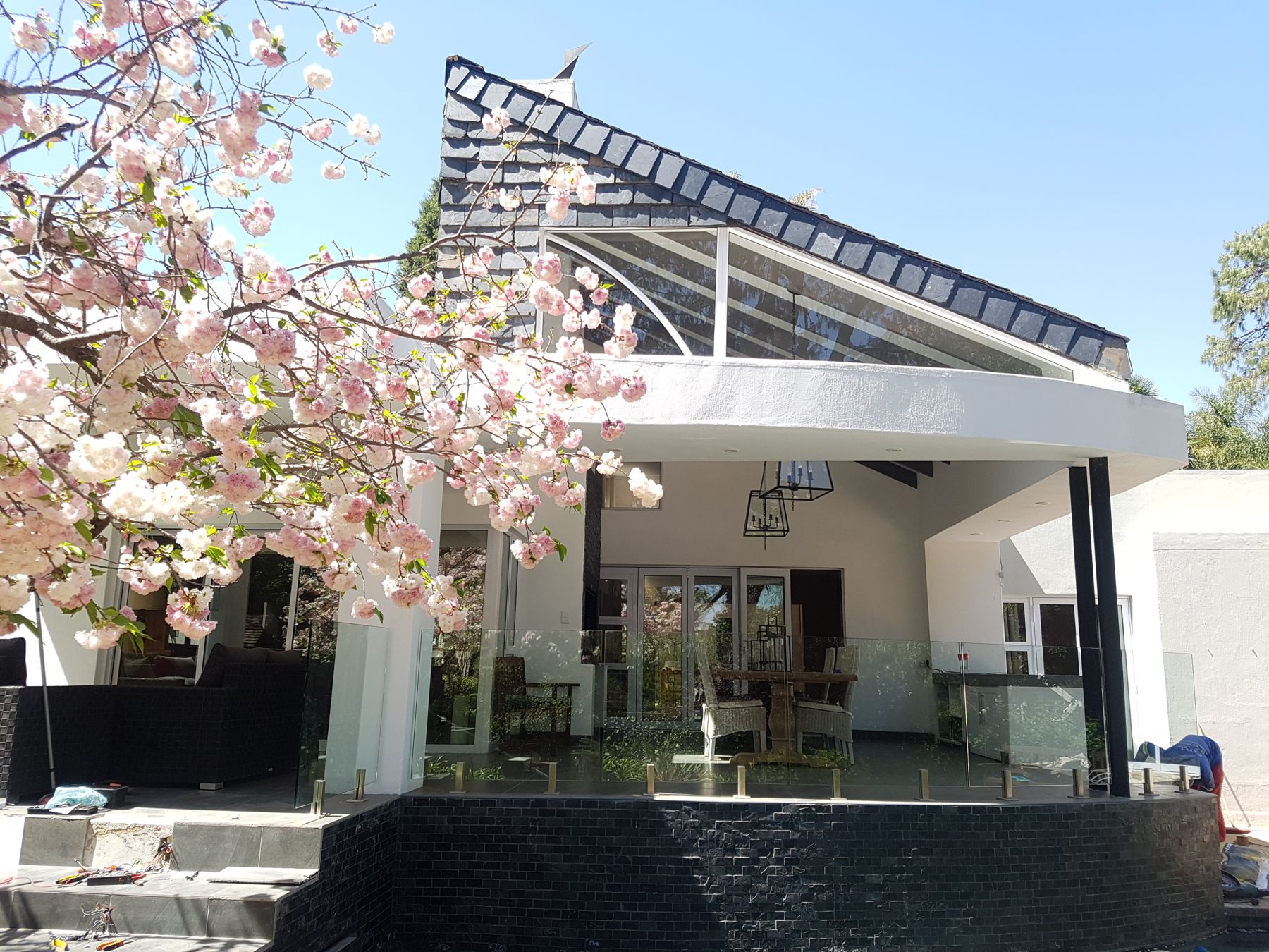 Glass-roofed patio addition to a house in Craighall