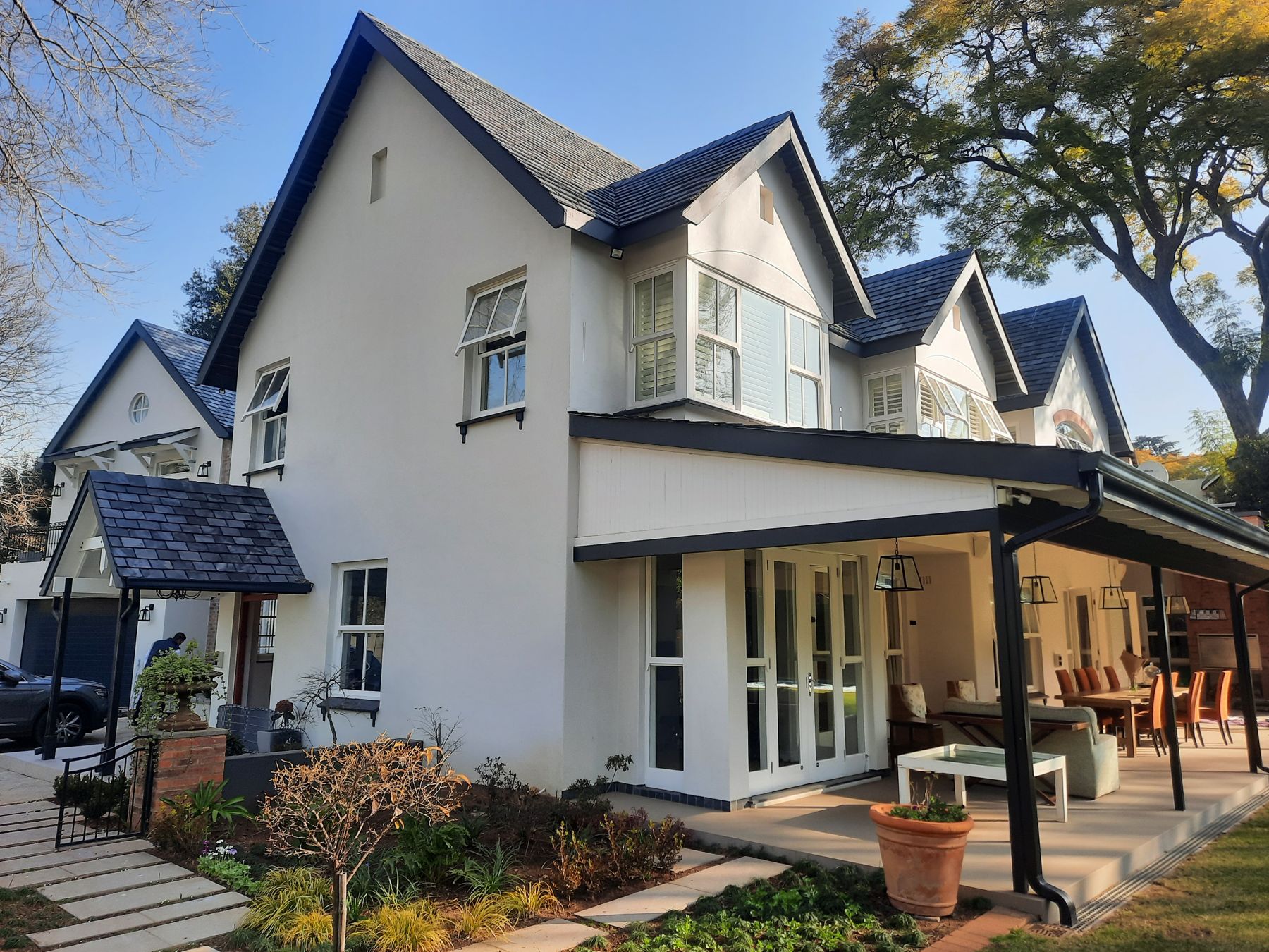 Garden verandah beneath the slate gables — Heritage house in Melrose