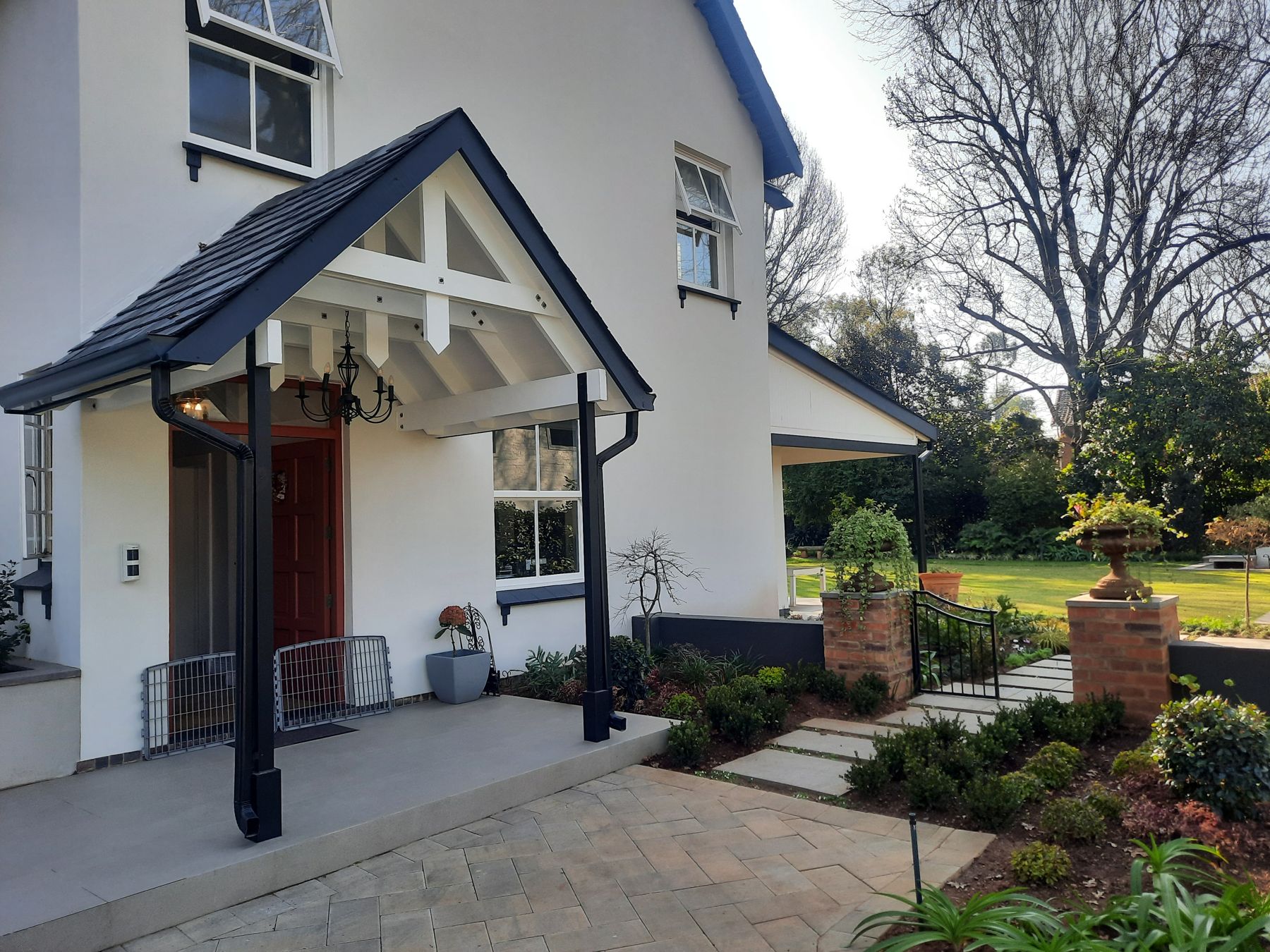 Gabled timber porch and red front door — Heritage house in Melrose