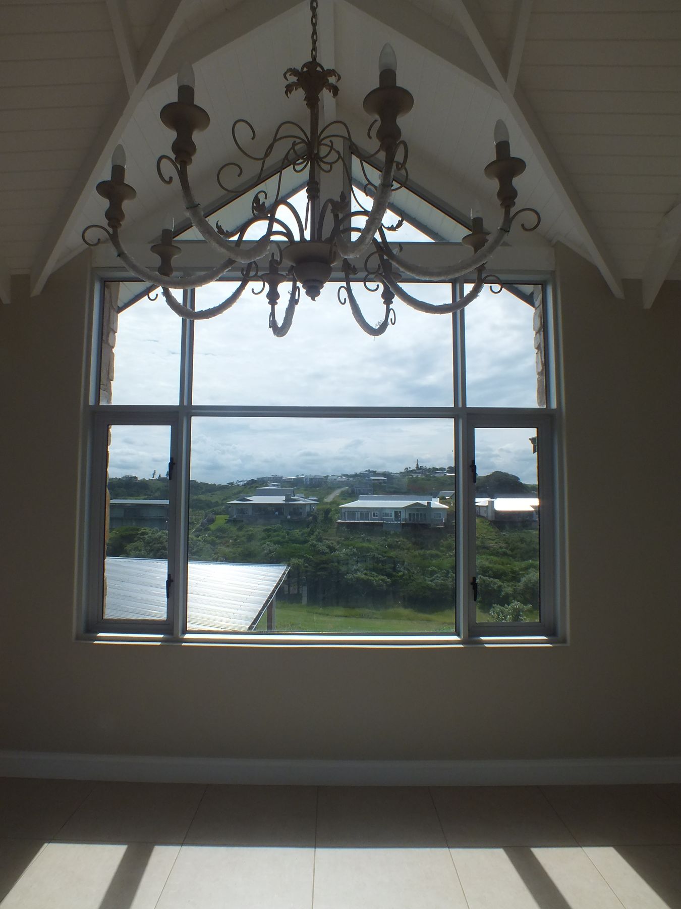 Gable window and chandelier — New house in Simbithi